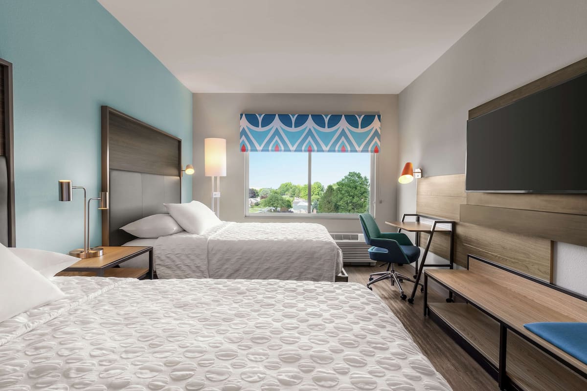 Premium bedding, desk, laptop workspace, blackout curtains