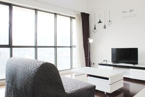 Deluxe-Apartment | Wohnzimmer | LED-Fernseher, Netflix