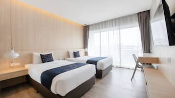 Chambre Deluxe avec lits jumeaux, vue océan | Minibar, coffres-forts dans les chambres, bureau, Wi-Fi gratuit