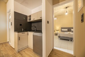Apartment, 1 Bedroom, Sea View | Private kitchen | Fridge, stovetop, electric kettle, cookware/dishes/utensils