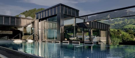 2 indoor pools, 2 outdoor pools, open 7:00 AM to 7:00 PM, pool umbrellas
