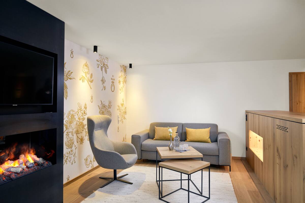 Penthouse SPA Suite HOCHKOENIGIN | Living area | Flat-screen TV, toys