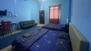 A room with two beds, a sofa, a desk, and a chair. - Kupi-Kupi & Stay (Ranau)