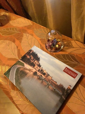 A brochure titled "RESIDENZA SAN FAUSTINO" on a table with a patterned tablecloth. - Residenza San Faustino (Verona)