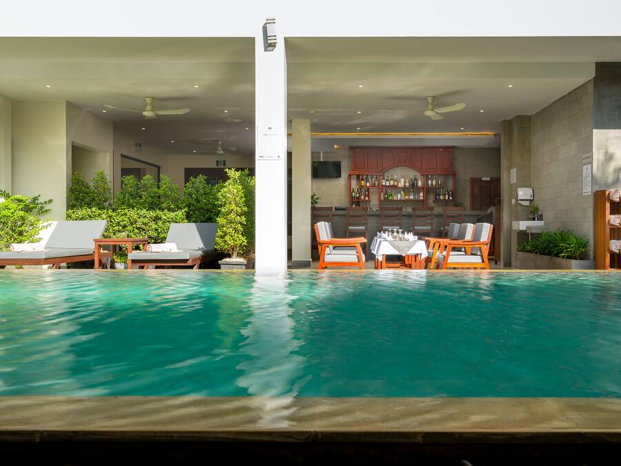 Outdoor pool, open 7:00 AM to 9:00 PM, pool umbrellas, sun loungers