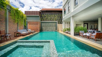 Outdoor pool, open 7:00 AM to 9:00 PM, pool umbrellas, sun loungers