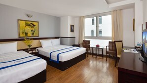 A hotel room with two beds, a desk, a chair, a TV, and a window with curtains. - Sunshine Hotel Nha Trang (Nha Trang)