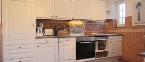Fridge, oven, coffee/tea maker, toaster