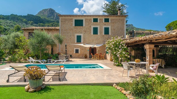 A stone building with a swimming pool, outdoor seating, and a garden. - VILLA FRONTERA - Villa with private pool and views to the mountains in Soller Free WiFi (S��ller)