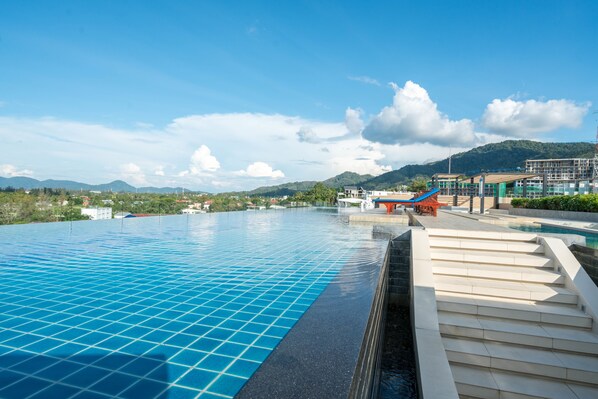 2 outdoor pools, pool umbrellas, sun loungers