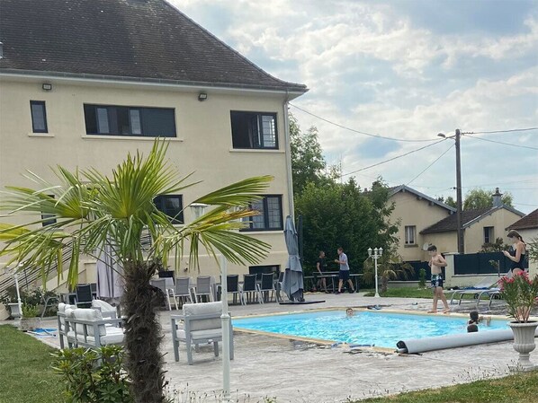 Seasonal outdoor pool, pool loungers