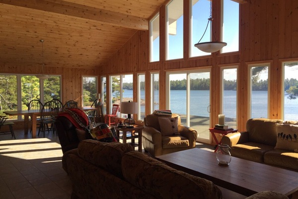 Expansive open concept lodge style cottage, with beautiful views of the lake.