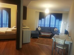 Deluxe Apartment | Living area | LED TV