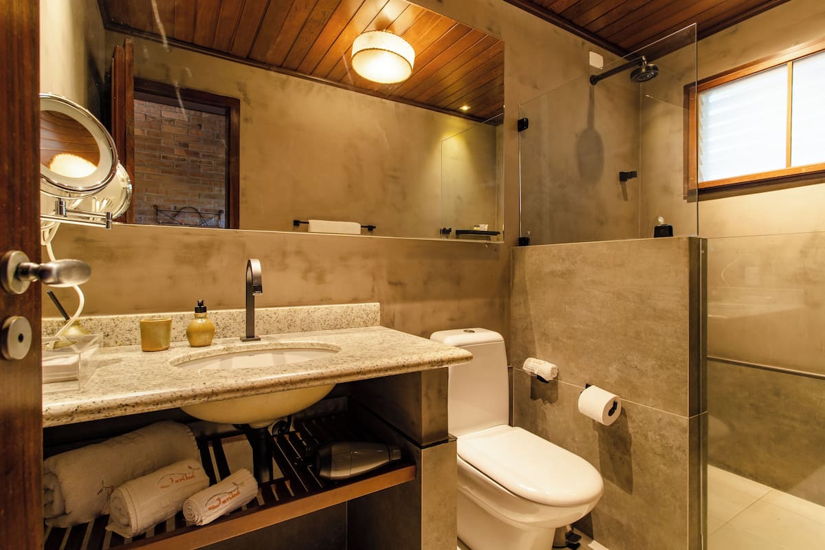 designer toiletries, hair dryer, towels, soap