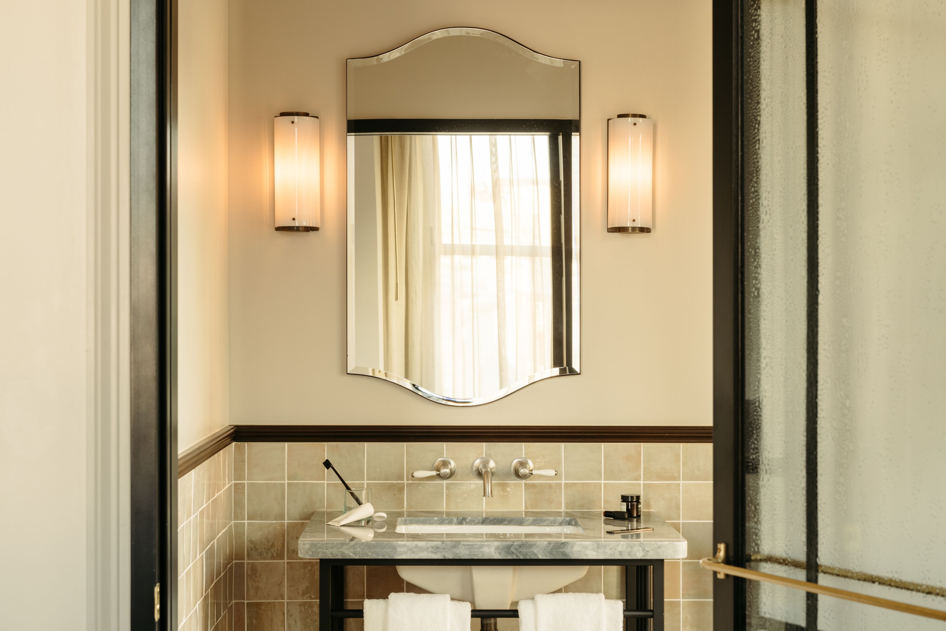 designer toiletries, hair dryer, towels, soap