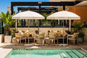 Outdoor pool, open 7:00 AM to 10:00 PM, free cabanas, pool umbrellas