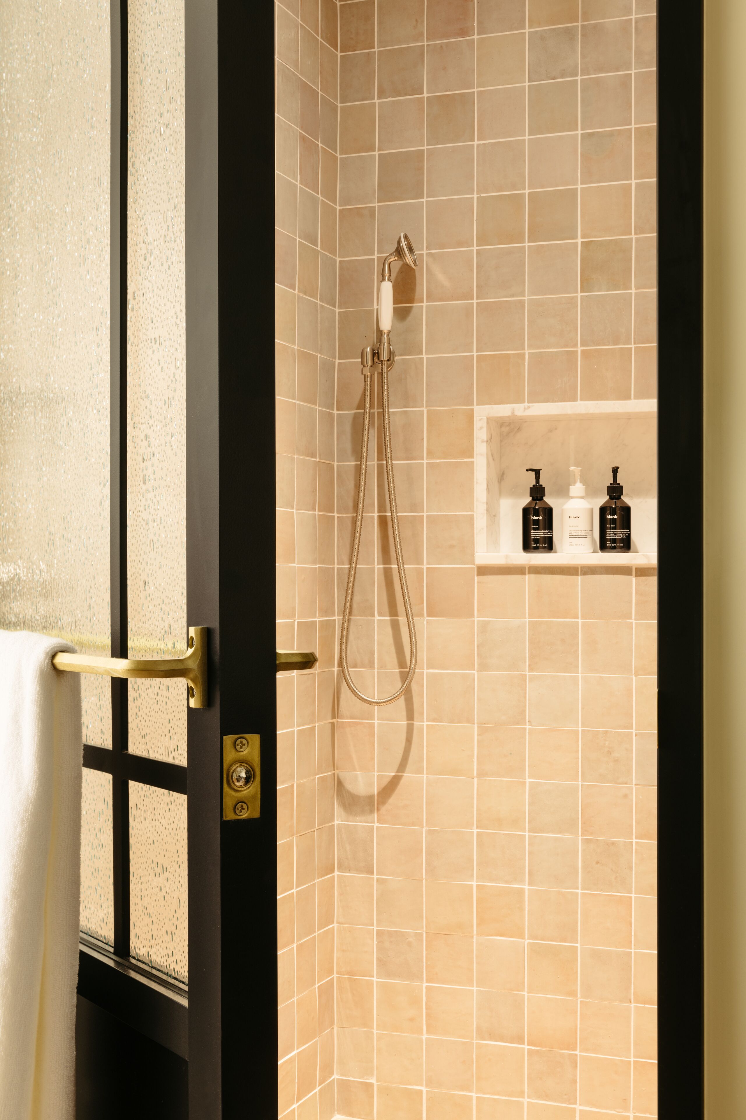 designer toiletries, hair dryer, towels, soap