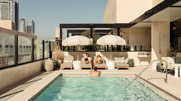 Outdoor pool, open 7:00 AM to 10:00 PM, free cabanas, pool umbrellas