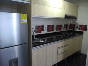Fridge, microwave, stovetop, coffee/tea maker