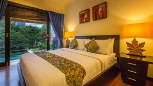 A hotel room with a large bed, two bedside tables, a nightstand, and a view of a garden and pool. - 2 Bedroom villa near Pandawa Beach (Uluwatu)