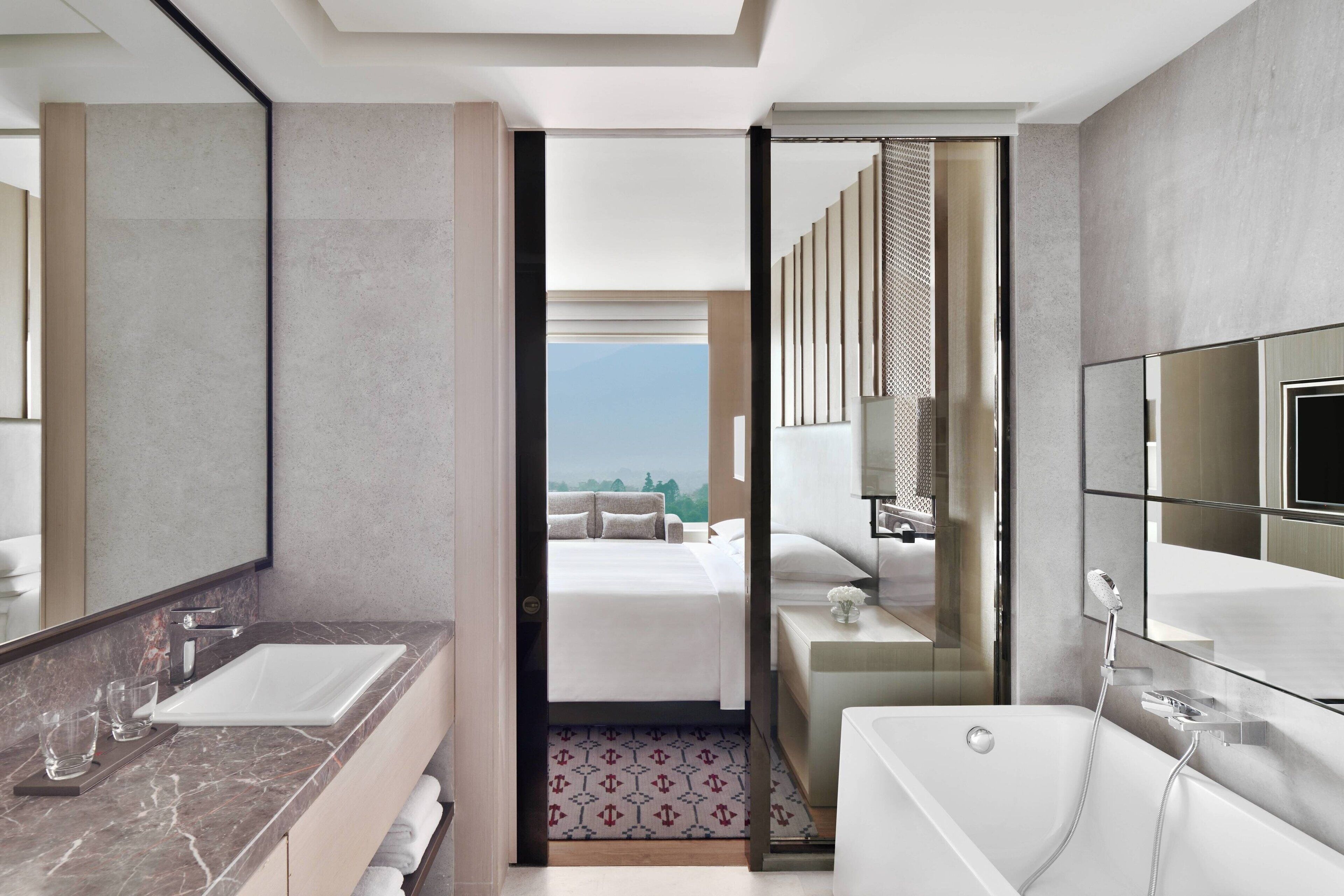 junior suite, 1 king bed, non smoking | bathroom | separate bathtub and shower, jetted bath, free toiletries, hair dryer