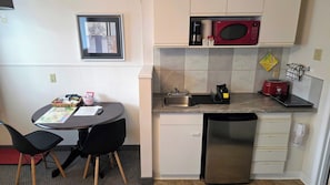 Deluxe Suite, 1 Queen Bed | Private kitchen | Microwave, coffee/tea maker, electric kettle, freezer