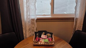 A wooden table with a tray of snacks and a sign for the Lila Motel. - Lido Motel (Radium Hot Springs)