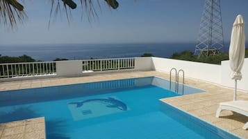 Seasonal outdoor pool, pool umbrellas, sun loungers