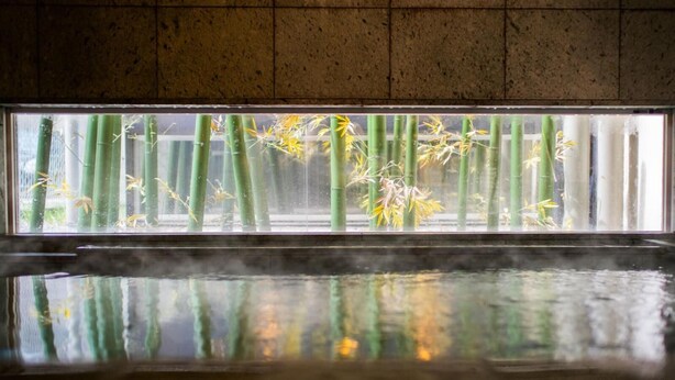 A room with a large window, a tiled wall, and a reflective floor. - Super Hotel Utsunomiya (Utsunomiya)