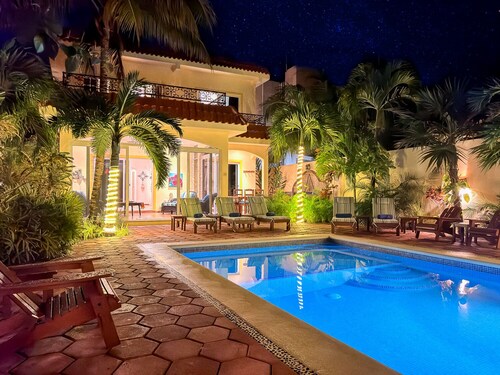 Spacious Hacienda style home with charming garden, screened porch and pool