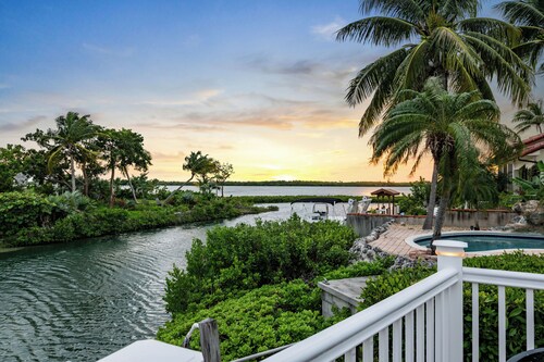 Waterfront home with a large dock, pool, and deck area. Can accommodate pets.