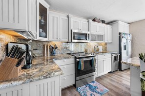 Fridge, microwave, oven, stovetop - Waterfront home with a large dock, pool, and deck area. Can accommodate pets. (Summerland)