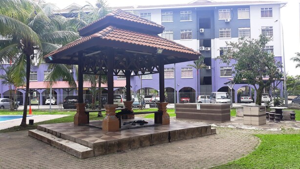A gazebo with a tiled roof, surrounded by a paved area with benches and a small pool. - Gateway Malaysia - Johor Bahru (Johor Bahru)