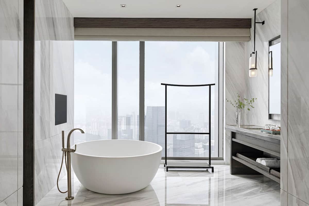 separate bathtub and shower, rainfall showerhead, designer toiletries