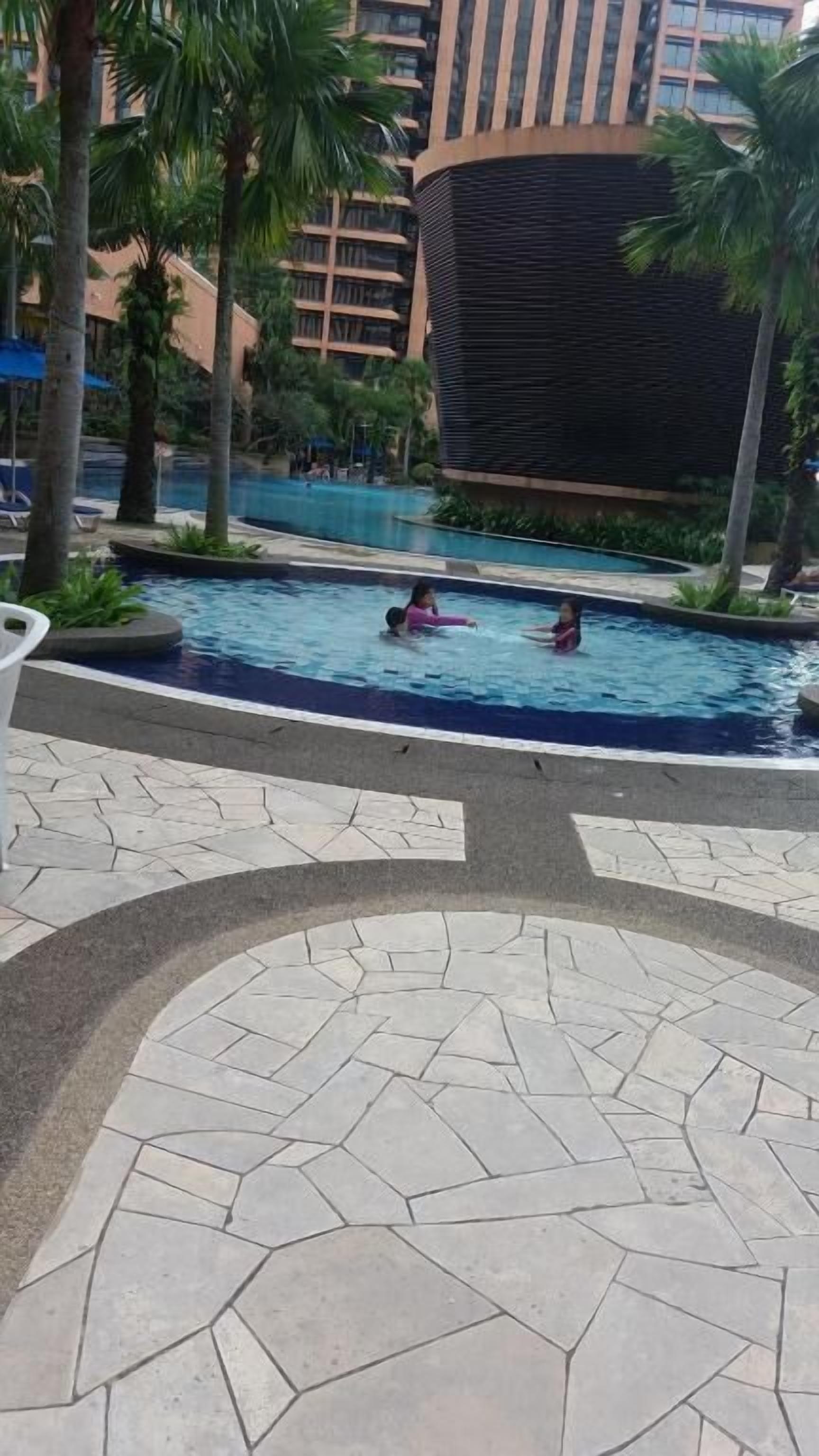 Outdoor pool, open 7:00 AM to 10:00 PM, pool umbrellas