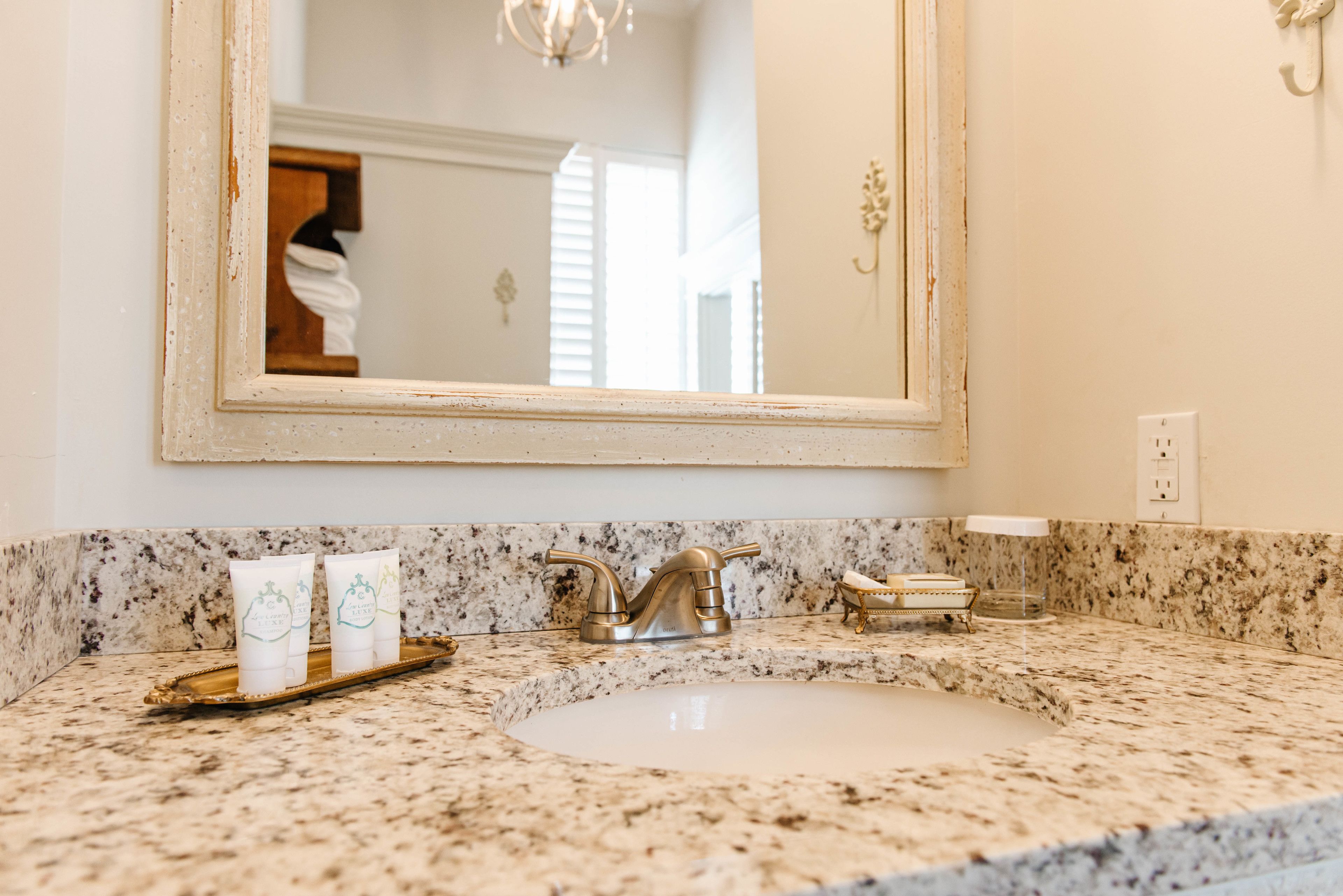 the louis winston suite | bathroom | combined shower/bathtub, designer toiletries, hair dryer, towels
