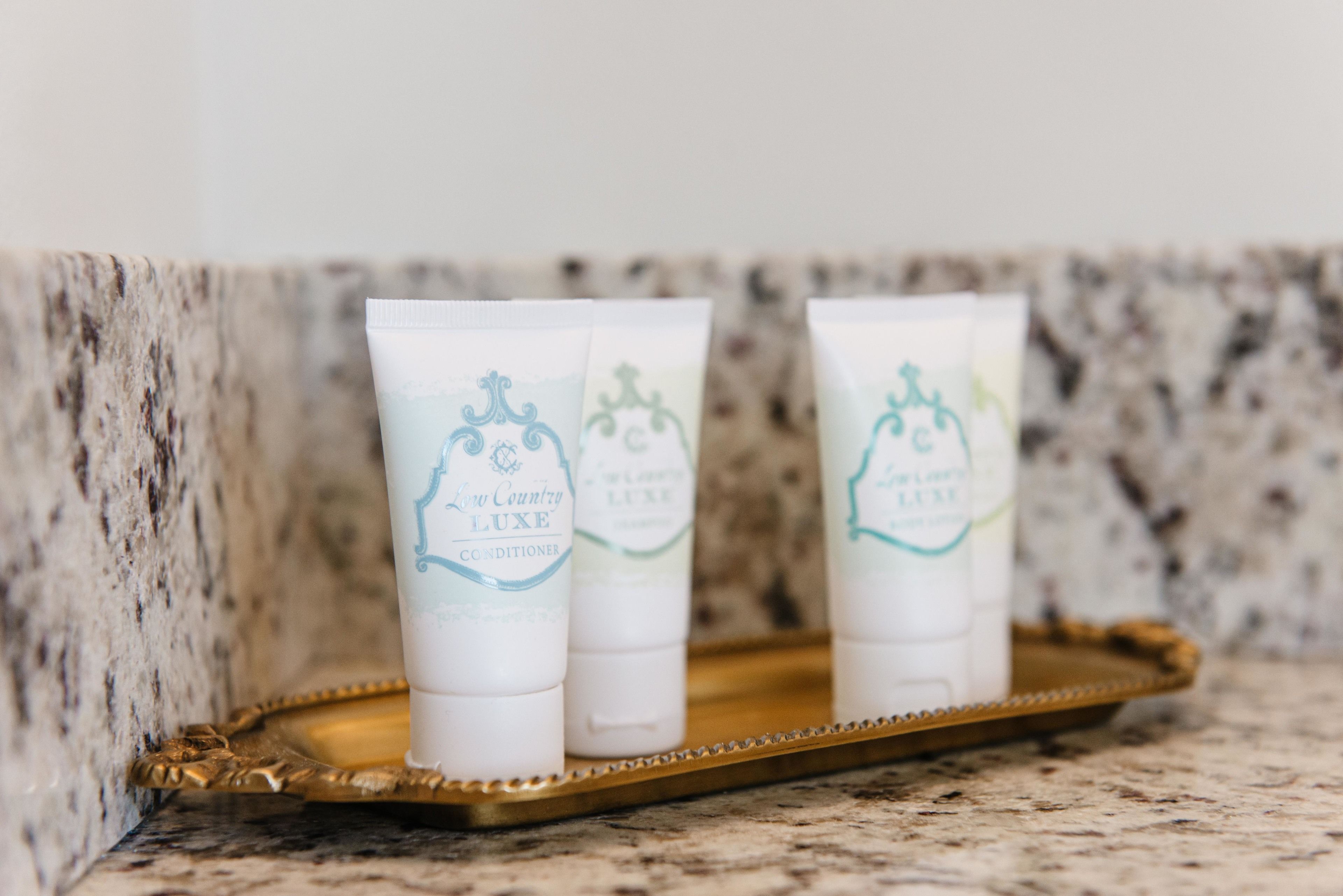 combined shower/bathtub, designer toiletries, hair dryer, towels