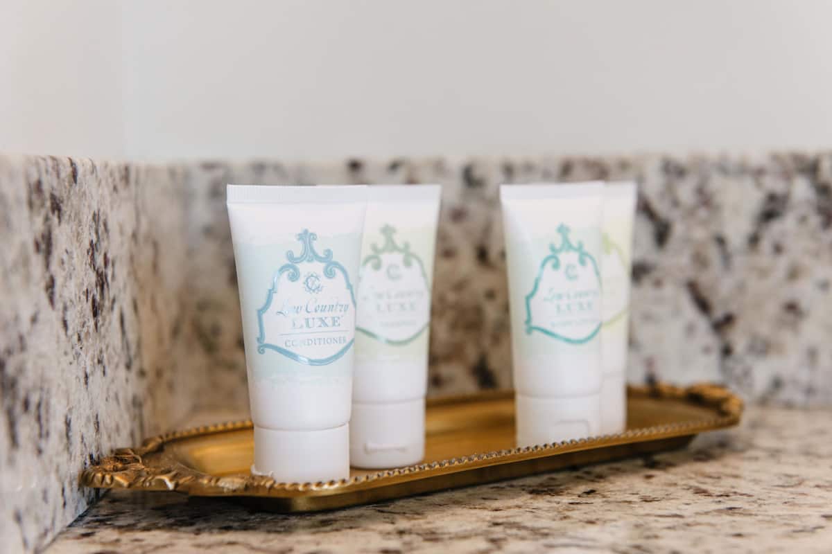 combined shower/bathtub, designer toiletries, hair dryer, towels