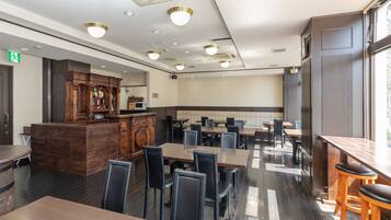 A restaurant with wooden furniture, a bar area, and a seating arrangement.
