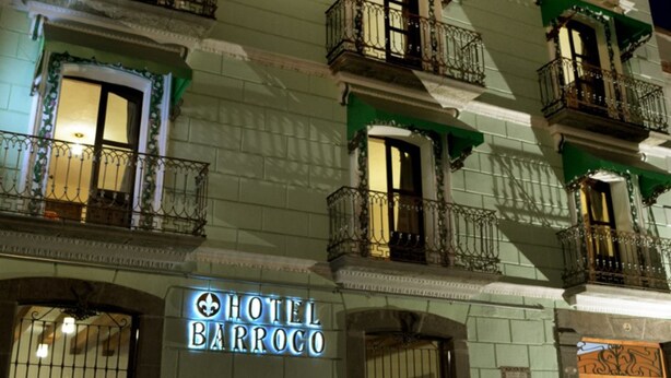 A hotel named "HOTEL BARROCO" with multiple balconies and a classic architectural style. - Hotel Barroco (Puebla)