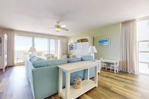 Relax in this inviting living room with a sofa, coffee table, and comfortable seating area.