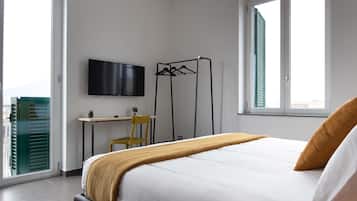 Premium bedding, desk, laptop workspace, soundproofing