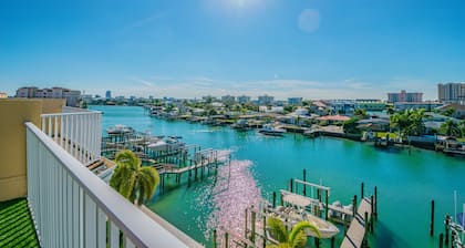 Luxury waterfront townhome, 5 min to beach, pool, fully stocked, & rooftop deck!