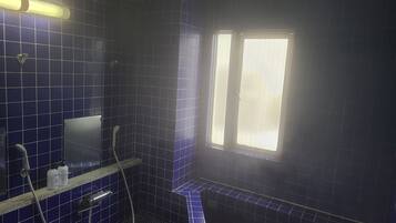 A bathroom with blue tiles, a window, and a shower area.