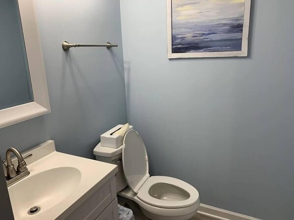 A bathroom with a sink, toilet, and a towel rack. - Gorgeous One Bedroom Ocean Creek Condo (Myrtle Beach)