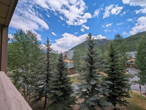 A mountain lodge with a view of the surrounding forest and mountains. - Mtn Views, Walk to Gondola, Pool & Hot Tubs (Keystone)