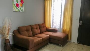 Superior Apartment | Living area | Flat-screen TV