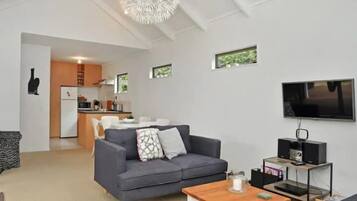 House, 2 Queen Beds | Living area | Flat-screen TV