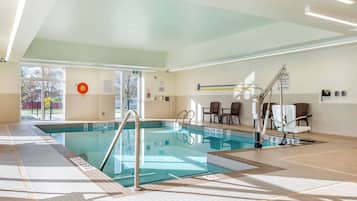 Indoor pool, open 10:00 AM to 10:00 PM, pool loungers