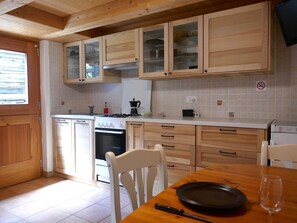Fridge, oven, high chair, cookware/dishes/utensils